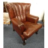 OVERSTUFFED RED LEATHER WINGBACK ARMCHAIR ON MAHOGANY BALL & CLAW SUPPORTS