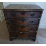 19TH CENTURY MAHOGANY CHEST OF DRAWERS WITH SHAPED CROSS BANDED TOP OVER 4 LONG DRAWERS ON BRACKET