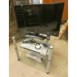 28" LG TV WITH SONY DVD PLAYER ON GLASS MEDIA STAND