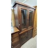 HARDWOOD DISPLAY CABINET WITH 2 GLAZED PANEL DOORS OPENING TO GLASS SHELVED INTERIOR OVER 2 DRAWERS