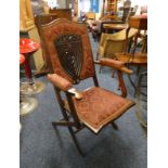 EARLY 20TH CENTURY MAHOGANY FOLDING ARMCHAIR WITH DECORATIVE CUSHIONED BACK & SEAT