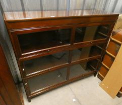 20TH CENTURY MAHOGANY SECTIONAL BOOKCASE WITH 3 GLAZED PANEL DOORS ON SQUARE SUPPORTS,
