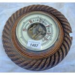 CIRCULAR CARVED OAK WALL BAROMETER,