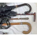 SILVER BANDED HORN HANDLED WALKING STICK TWO SILVER BANDED PARASOLS AND A GOLD BANDED UMBRELLA