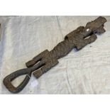TRIBAL CARVED HARDWOOD FIGURE OF A CROCODILE EATING A FISH WITH THE HANDLE FOR TAIL,
