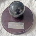 HMS VICTORY 1765 PLAQUE WITH METAL CANNON BALL WITH REFERENCE NUMBER IN WHITE INK TO CANNON BALL ON