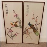 2 FRAMED ORIENTAL SILK WORK PICTURES OF BIRDS IN CHERRY BLOSSOM TREES SIGNED WITH ORIENTAL SYMBOLS.