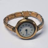 9CT GOLD LADIES WRISTWATCH ON A 9CT GOLD BRACELET - 28.