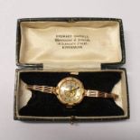 9CT GOLD LADIES WRISTWATCH ON A 14K GOLD BRACELET - 18.