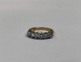 18CT GOLD DIAMOND SET 6 - STONE RING, THE BRILLIANT CUT DIAMONDS APPROX 1.