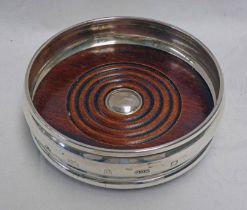 MODERN SILVER WINE COASTER WITH TURNED WOODEN BASE