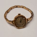 9CT GOLD LADIES WRISTWATCH ON A 9CT GOLD BRACELET - 20.