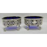 PAIR OF GEORGE III SILVER OVAL SALTS WITH PIERCED SIDES,