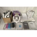 2 NINTENDO WII CONSOLES TOGETHER WITH CONTROLLERS & A SELECTION OF GAMES INCLUDING MARIO KART WII,