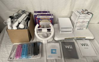 2 NINTENDO WII CONSOLES TOGETHER WITH CONTROLLERS & A SELECTION OF GAMES INCLUDING MARIO KART WII,