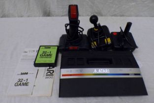 ATARI 2600 CONSOLE TOGETHER WITH VARIOUS JOY STICKS