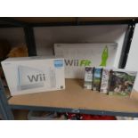 NINTENDO WII CONSOLE TOGETHER WITH BALANCE BOARD AND SEVERAL GAMES.