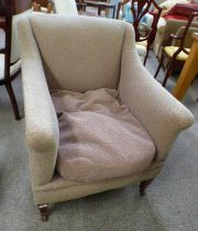 20TH CENTURY OVERSTUFFED ARMCHAIR ON MAHOGANY SQUARE TAPERED SUPPORTS.