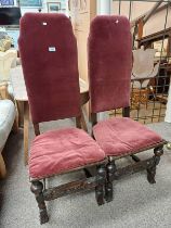 PAIR OF 20TH CENTURY CARVED OAK HALL CHAIRS WITH PADDED BACKS,