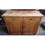 19TH CENTURY PINE DRESSER WITH 2 DRAWERS OVER 2 PANEL DOORS OPENING TO SHELVED INTERIOR 94 CM TALL