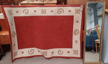 RED & BEIGE PATTERN RUG & GILT FRAMED RECTANGULAR MIRROR WITH BEVELLED EDGE, DIMENSIONS OF CARPET,