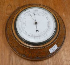 LATE 19TH CENTURY ANEROID BAROMETER IN DECORATIVE FRAME,