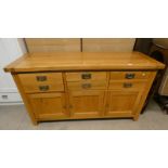 21ST CENTURY OAK SIDEBOARD WITH 6 DRAWERS OVER 3 PANEL DOORS ON SQUARE SUPPORTS,