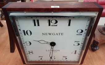 ART DECO STYLE HARDWOOD CASED WALL CLOCK.