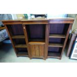 20TH CENTURY WALNUT BREAKFRONT BOOKCASE WITH CENTRALLY SET PANEL DOOR FLANKED EACH SIDE BY