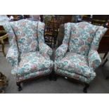 PAIR OF 19TH CENTURY STYLE WINGBACK ARMCHAIRS ON CARVED MAHOGANY BASES WITH BALL & CLAW SUPPORTS.