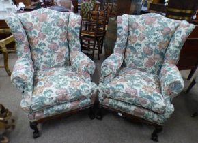 PAIR OF 19TH CENTURY STYLE WINGBACK ARMCHAIRS ON CARVED MAHOGANY BASES WITH BALL & CLAW SUPPORTS.