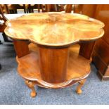 20TH CENTURY MAHOGANY REVOLVING BOOK TABLE WITH SHAPED TOP ON DECORATIVE SHORT QUEEN - ANNE