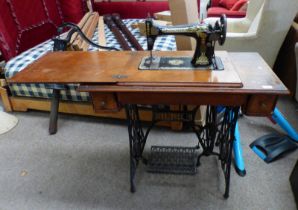 MAHOGANY SINGER SEWING TABLE WITH 2 DRAWERS & FOLD-OUT SEWING MACHINE ON CAST IRON TREADLE MACHINE