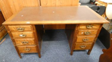 LATE 19TH CENTURY OAK TWIN PEDESTAL DESK WITH 2 STACKS OF 4 DRAWERS