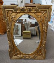 GILT FRAMED MIRROR WITH OVAL BEVELLED EDGE GLASS,