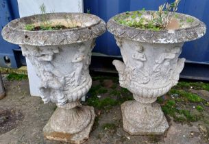 PAIR OF RECONSTITUTED STONE GARDEN URNS WITH FIGURAL DECORATION.
