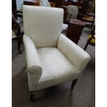 20TH CENTURY OVERSTUFFED ARMCHAIR ON MAHOGANY SQUARE TAPERED SUPPORTS