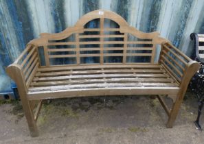 WOODEN GARDEN BENCH WITH SHAPED BACK Condition Report: The lot is a hardwood of