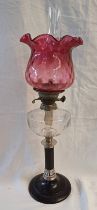 ARTS & CRAFTS STYLE PARAFIN LAMP WITH METAL & CHROME COLUMN & CRANBERRY GLASS SHADE