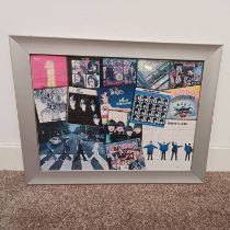 FRAMED 1000 PIECE JIGSAW OF VARIOUS BEATLES ALBUM COVERS,