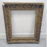 LARGE GILT PICTURE FRAME WITH FLORAL DECORATION THROUGHOUT, BROKEN PIECE INCLUDED,