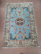 BLUE AND CREAM ORIENTAL RUG WITH ORIENTAL DECORATION,