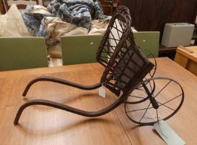 20TH CENTURY OAK CHILD'S TOY CART WITH WICKER BASKET ON CAST METAL WHEELS