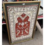 SILK CARPET MOUNTED ON A GILT FRAME,