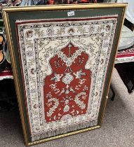 SILK CARPET MOUNTED ON A GILT FRAME,