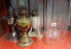 3 PARAFFIN LAMPS WITH GLASS SHADES