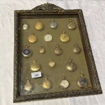 VARIOUS DECORATIVE POCKETWATCHES IN HANGING WALL CABINET