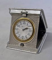 SILVER ENGINE TURNED TRAVELLING CLOCK WITH RAISED FOLIATE BORDER BY WILLIAM BASE & SONS,