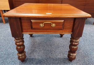 MAHOGANY SQUARE COFFEE TABLE WITH SINGLE DRAWER ON BOBBIN SUPPORTS.