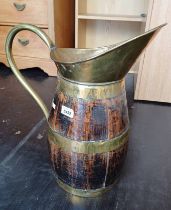 OAK JUG WITH BRASS HANDLE & BANDING Condition Report: The lot has age related marks,